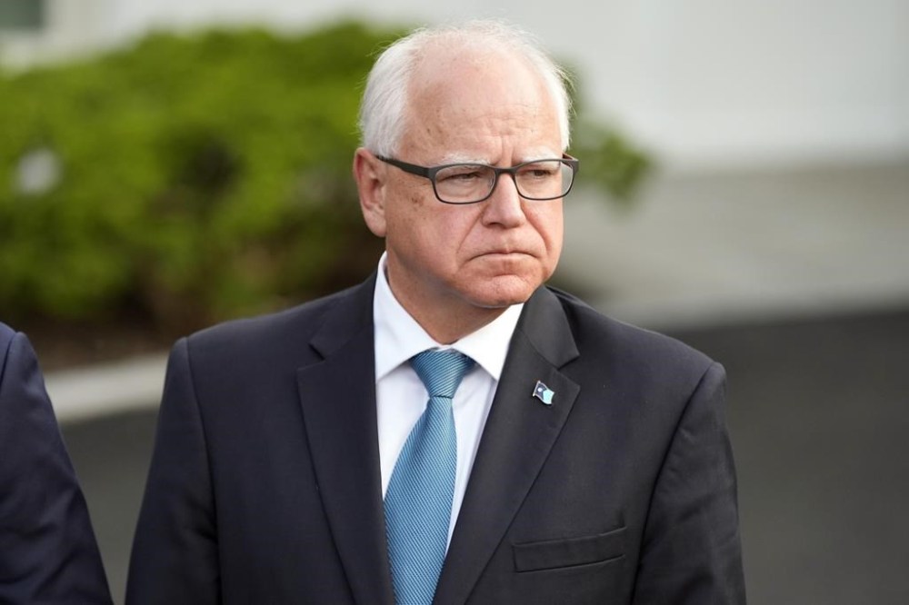 Minnesota Gov. Tim Walz listens after meeting with President Joe Biden, July 3, 2024, at the White House in Washington. Reports say Vice President Kamala Harris has picked Walz to be her running mate marking a major milestone since her move to the top of the Democratic ticket ahead of the November election. THE CANADIAN PRESS/AP/Jacquelyn Martin