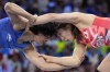 Japan's Yui Susaki and India's Vinesh Vinesh, left, compete in the round of 16 of the women's freestyle 50kg wrestling match, at Champ-de-Mars Arena, during the 2024 Summer Olympics, Tuesday, Aug. 6, 2024, in Paris, France. (AP Photo/Eugene Hoshiko)