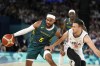 Australia'a Patty Mills, left, tries to get by Serbia's Aleksa Avramovic, during a men's quarterfinal game at Bercy Arena at the 2024 Summer Olympics, Tuesday, Aug. 6, 2024, in Paris, France. (AP Photo/Michael Conroy)