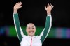 Kaylia Nemour, of Algeria, celebrates after winning the gold medal during the women's artistic gymnastics individual uneven bars finals at Bercy Arena at the 2024 Summer Olympics, Sunday, Aug. 4, 2024, in Paris, France. (AP Photo/Charlie Riedel)
