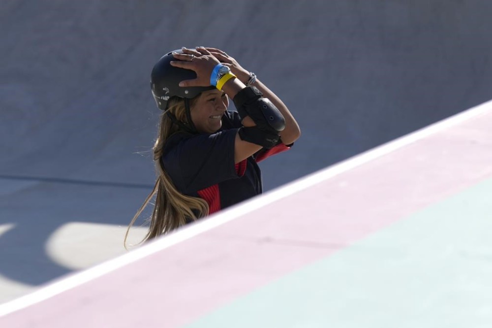 Sky Brown of Great Britain reacts after her run during the women's skateboarding park final at the 2024 Summer Olympics, Tuesday, Aug. 6, 2024, in Paris, France. (AP Photo/Vadim Ghirda)
