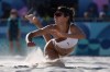 Canada's Melissa Humana-Paredes hits the sand as she watches her return shot in a beach volleyball match against the United States at the 2024 Summer Olympics, Monday, Aug. 5, 2024, in Paris, France. From Andre De Grasse's 200-metre semifinal to Canadians in beach volleyball action, here are five things to look out for at the Paris Olympics on Wednesday, Aug. 7 THE CANADIAN PRESS/AP/Robert F. Bukaty