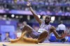 Jarrion Lawson, of the United States, competes in the men's long jump qualification at the 2024 Summer Olympics, Sunday, Aug. 4, 2024, in Saint-Denis, France. (AP Photo/Matthias Schrader)