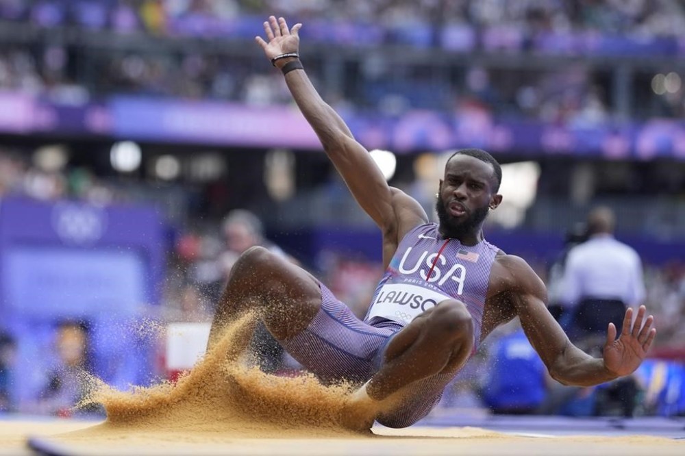 Jarrion Lawson, of the United States, competes in the men's long jump qualification at the 2024 Summer Olympics, Sunday, Aug. 4, 2024, in Saint-Denis, France. (AP Photo/Matthias Schrader)