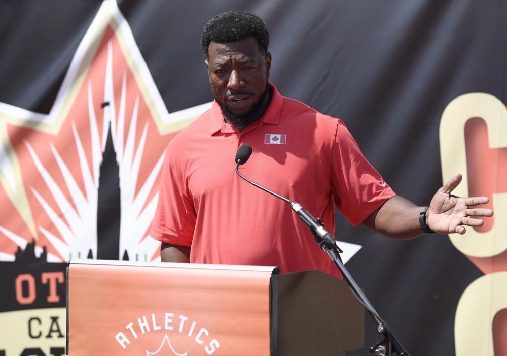 Athletics Canada head coach Glenroy Gilbert says his organization doesn't need to overhaul its accreditation process after the personal coach of sprinter Andre De Grasse was kicked out of the Paris Olympics. Gilbert speaks at a press conference at the Canadian Track and Field Championships in Ottawa on Thursday, July 5, 2018. THE CANADIAN PRESS/Justin Tang