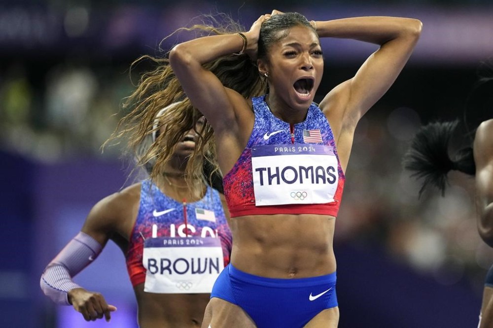 Gabrielle Thomas, of the United States, reacts after winning the women's 200-meters final at the 2024 Summer Olympics, Tuesday, Aug. 6, 2024, in Saint-Denis, France. (AP Photo/Petr David Josek)