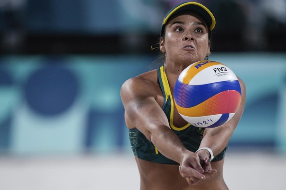 Australia's Mariafe Artacho Del Solar hits the ball during the women's quaterfinal beach volleyball match between Australia and Switzerland at Eiffel Tower Stadium at the 2024 Summer Olympics, Tuesday, Aug. 6, 2024, in Paris, France. (AP Photo/Louise Delmotte)