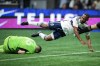 Vancouver Whitecaps' Junior Hoilett, right, is stopped by Los Angeles FC goalkeeper Maxime Crepeau as he stumbles over him during the second half of an MLS soccer match, in Vancouver, B.C., Saturday, Oct. 21, 2023. Veteran Canadian international Junior Hoilett has signed a one-year contract with Scotland's Hibernian. THE CANADIAN PRESS/Darryl Dyck