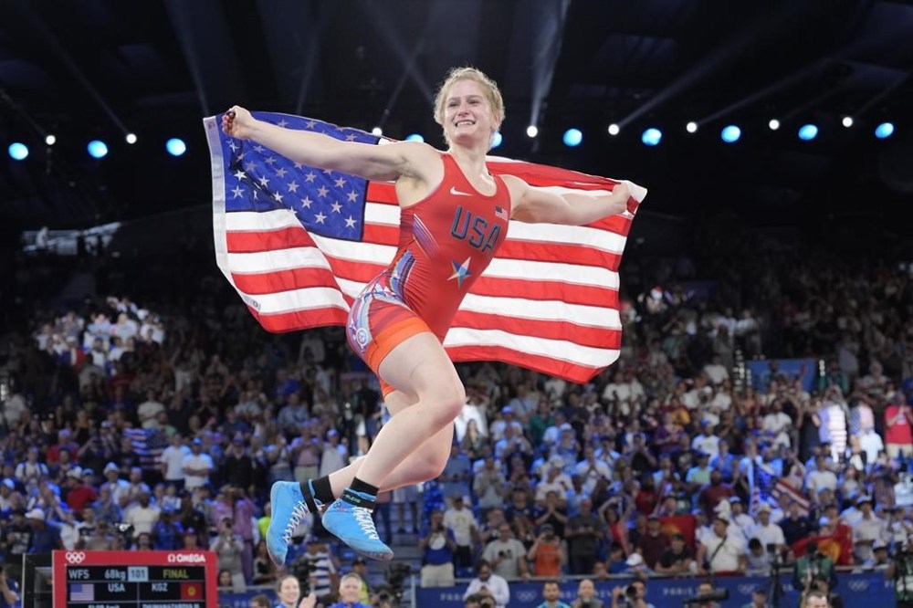 United State's Amit Elor celebrates after defeating Kyrgyzstan's Meerim Zhumanazarova during their women's freestyle 68kg wrestling final match, at Champ-de-Mars Arena, during the 2024 Summer Olympics, Tuesday, Aug. 6, 2024, in Paris, France. (AP Photo/Eugene Hoshiko)