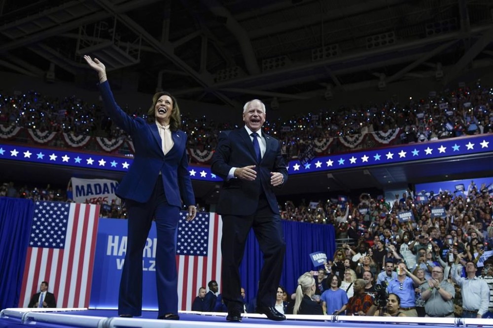 Democratic presidential nominee Vice President Kamala Harris and her running mate Minnesota Gov. Tim Walz arrive at a campaign rally in Philadelphia, Tuesday, Aug. 6, 2024. (AP Photo/Matt Rourke)
