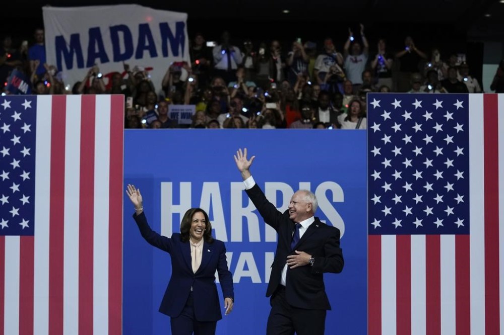 Democratic presidential nominee Vice President Kamala Harris and her running mate Minnesota Gov. Tim Walz arrive at a campaign rally in Philadelphia, Tuesday, Aug. 6, 2024. (AP Photo/Matt Rourke)