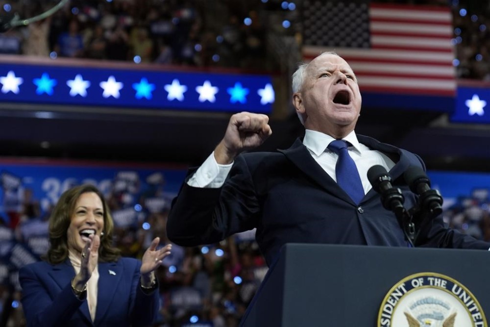 Democratic vice presidential nominee Minnesota Gov. Tim Walz and Democratic presidential nominee Vice President Kamala Harris speak at a campaign rally in Philadelphia, Tuesday, Aug. 6, 2024. (AP Photo/Matt Rourke)