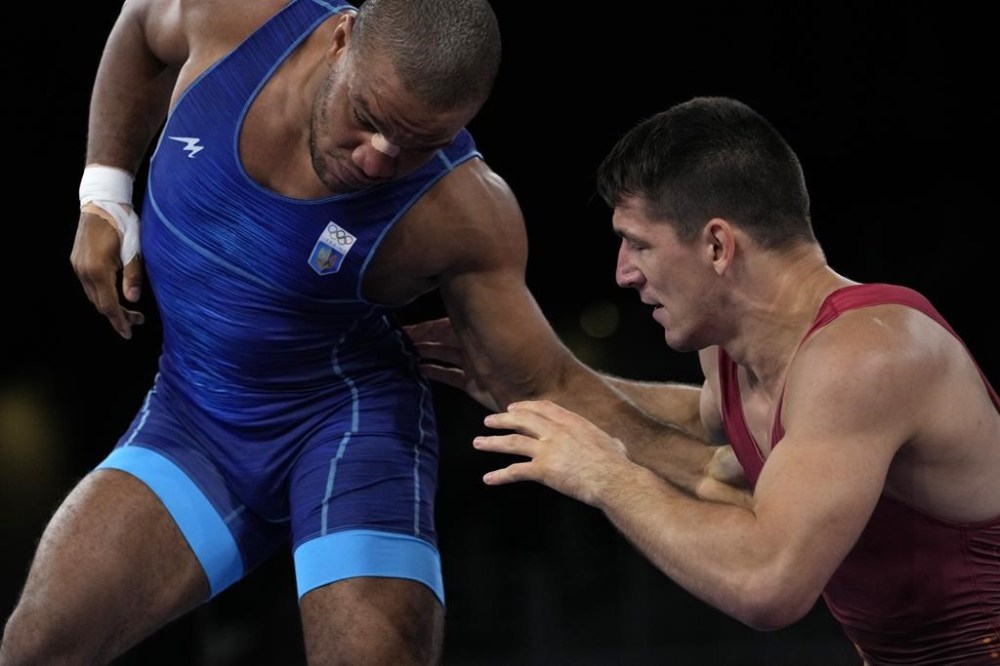 FILE - Hungary's Viktor Lorincz, right, and Ukraine's Zhan Beleniuk compete during the men's 87kg Greco-Roman wrestling final match at the 2020 Summer Olympics, Wednesday, Aug. 4, 2021, in Chiba, Japan. (AP Photo/Aaron Favila, File)