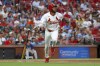 St. Louis Cardinals' Victor Scott II runs after hitting a two-run home run during the second inning of a baseball game against the Tampa Bay Rays, Tuesday, Aug. 6, 2024, in St. Louis. (AP Photo/Scott Kane)