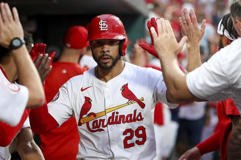 St. Louis Cardinals' Tommy Pham is congratulated by teammates after hitting a two-run home run during the second inning of a baseball game against the Tampa Bay Rays, Tuesday, Aug. 6, 2024, in St. Louis. (AP Photo/Scott Kane)