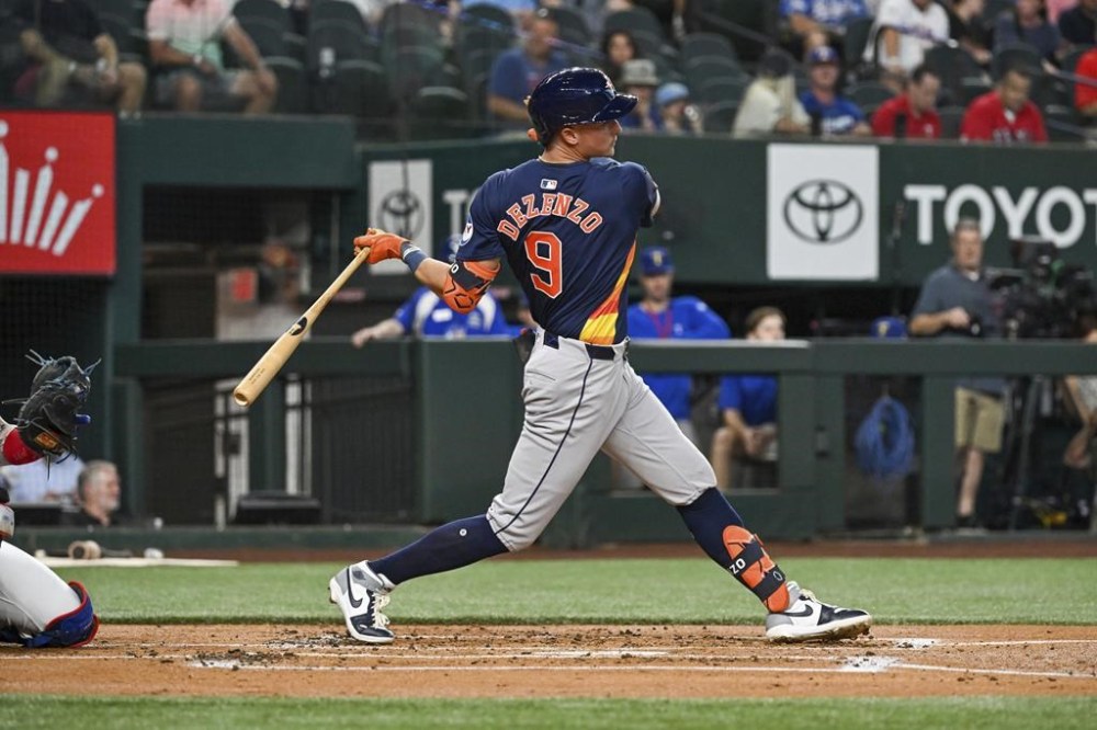 Houston Astros Zach Dezenzo swings through a pitch in his first Major League at bat in the second inning of a baseball game against the Houston Astros, Tuesday, Aug 6, 2024, in Arlington, Texas. (AP Photo/Albert Pena)