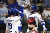 Kansas City Royals' Bobby Witt Jr., right, congratulates Kansas City Royals' Michael Massey after his home run during the fifth inning of a baseball game against the Boston Red Sox, Tuesday, Aug. 6, 2024, in Kansas City, Mo. (AP Photo/Reed Hoffmann)