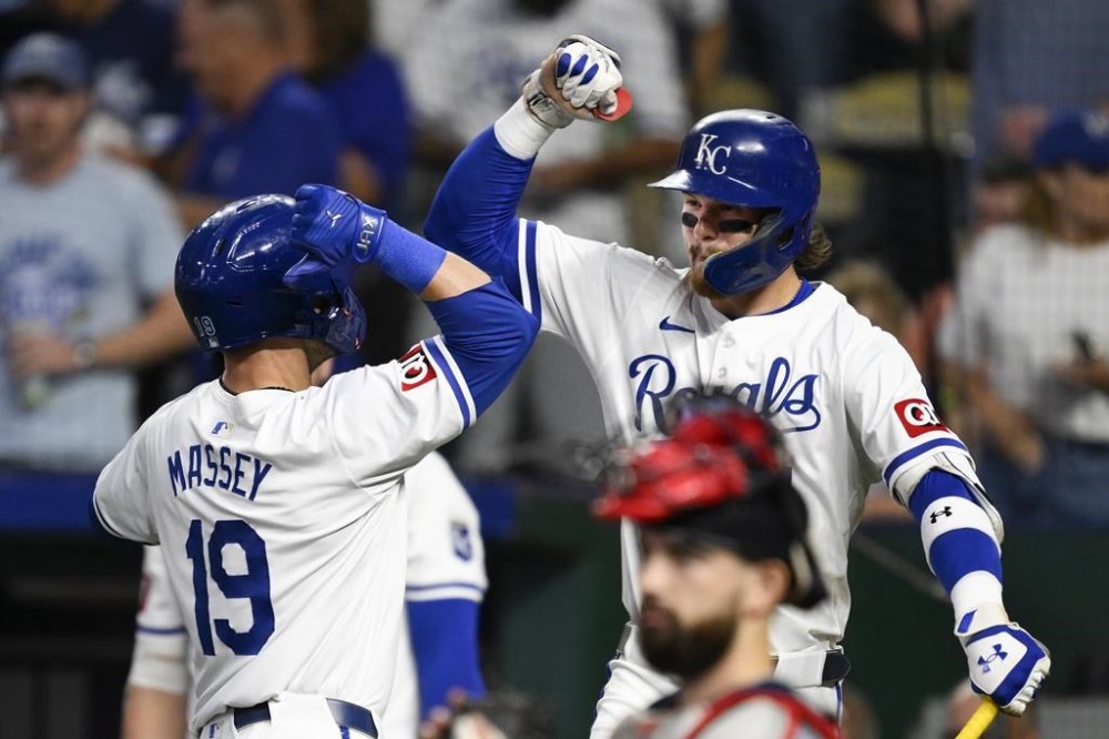Kansas City Royals' Bobby Witt Jr., right, congratulates Kansas City Royals' Michael Massey after his home run during the fifth inning of a baseball game against the Boston Red Sox, Tuesday, Aug. 6, 2024, in Kansas City, Mo. (AP Photo/Reed Hoffmann)