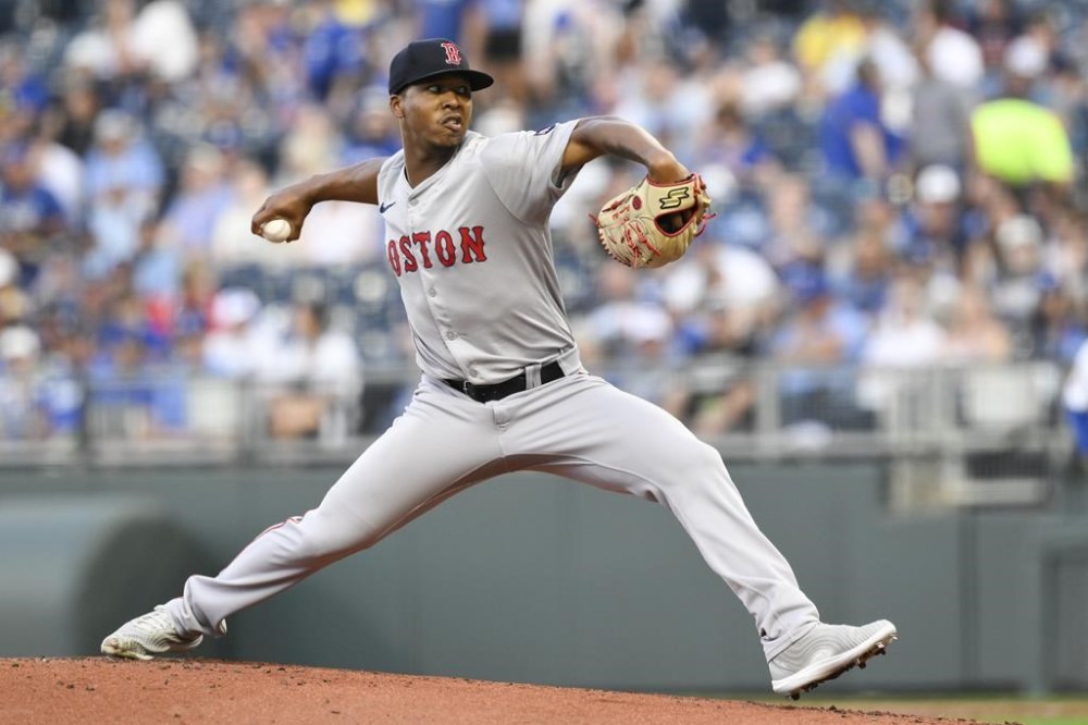 Boston Red Sox starting pitcher Brayan Bello throws to a Kansas City Royals batter during the first inning of a baseball game, Tuesday, Aug. 6, 2024, in Kansas City, Mo. (AP Photo/Reed Hoffmann)