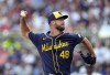 Milwaukee Brewers starting pitcher Colin Rea works against the Atlanta Braves in the first inning of a baseball game, Tuesday, Aug. 6, 2024, in Atlanta. (AP Photo/John Bazemore)