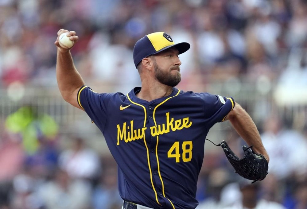 Milwaukee Brewers starting pitcher Colin Rea works against the Atlanta Braves in the first inning of a baseball game, Tuesday, Aug. 6, 2024, in Atlanta. (AP Photo/John Bazemore)