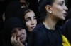Mourners attend the funeral of Hezbollah commander Ali Jawad who was killed on Monday by an Israeli airstrike, in Beirut, Lebanon, Tuesday, Aug. 6, 2024. Since early October, Hezbollah began attacking Israeli military posts along the border calling it a backup front for their Palestinian allies in the Gaza Strip. (AP Photo/Hussein Malla)