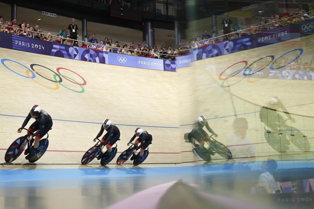 Britain's Katy Marchant, Britain's Sophie Capewell and Britain's Emma Finucane compete during the women's team sprint event, at the 2024 Summer Olympics, Monday, Aug. 5, 2024, in Paris, France. (AP Photo/Thibault Camus)