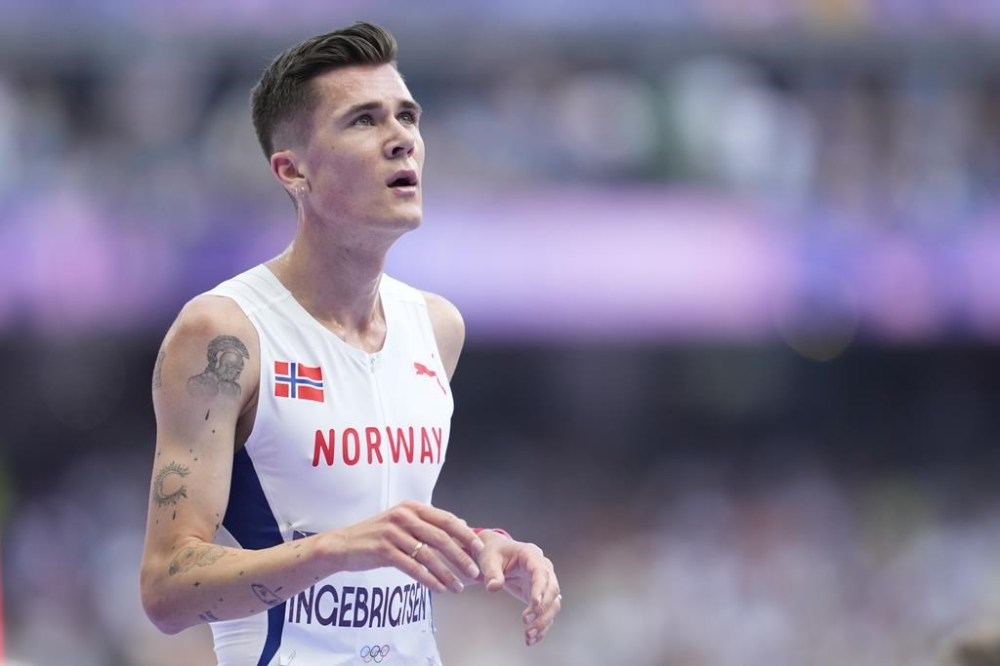 Jakob Ingebrigtsen, of Norway, reacts following his men's 5000-meter heat at the 2024 Summer Olympics, Wednesday, Aug. 7, 2024, in Saint-Denis, France. (AP Photo/Ashley Landis)
