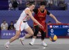 Paige Crozon, from Humboldt, Sask. chases a loose ball with China's Jiyuan Wan during a 3x3 basketball game at the Summer Olympics, Wednesday, July 31, 2024 in Paris. THE CANADIAN PRESS/Adrian Wyld