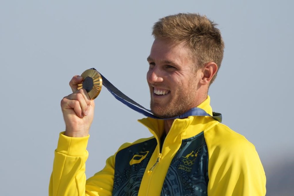 Matthew Wearn of Australia holds his gold medal during a medal ceremony after winning the ILCA 7 men's dinghy class final race during the 2024 Summer Olympics, Wednesday, Aug. 7, 2024, in Marseille, France. (AP Photo/Carolyn Kaster)