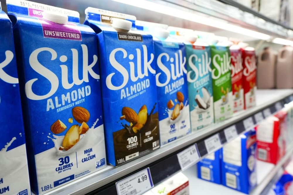 Almond and other alternatives to dairy milk products are displayed for sale at a grocery store in Aylmer, Que., on Thursday, May 26, 2022. The Canadian Food Inspection Agency says the recent Listeria contamination of several plant-based milks happened in a Pickering, Ont. facility called Joriki Inc. THE CANADIAN PRESS/Sean Kilpatrick