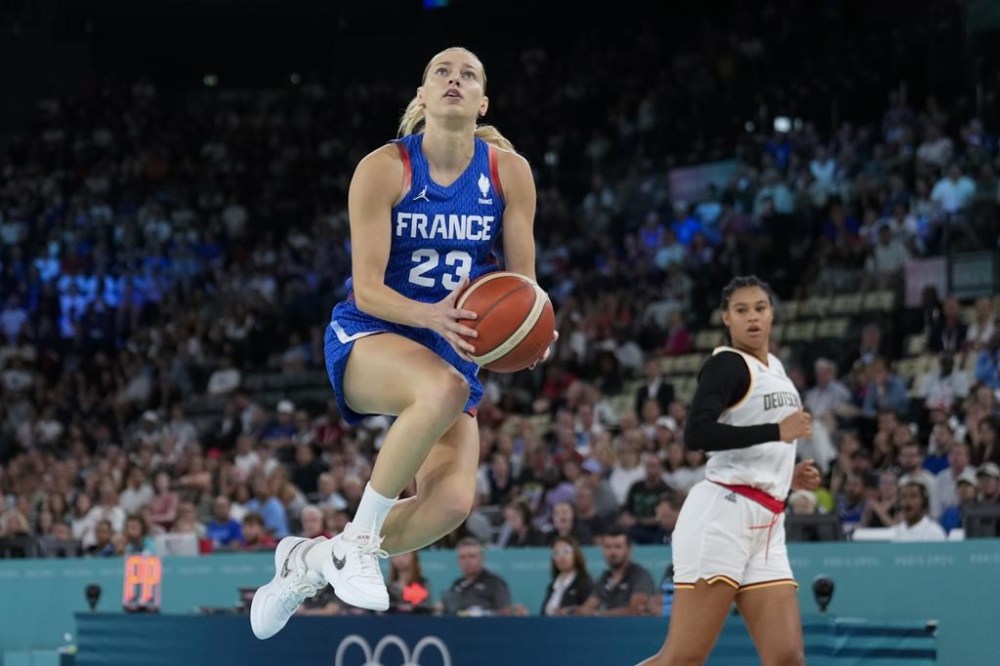 Marine Johannes (23), of France, shoots against Germany during a women's quarterfinal game at Bercy Arena at the 2024 Summer Olympics, Wednesday, Aug. 7, 2024, in Paris, France. (AP Photo/Mark J. Terrill)