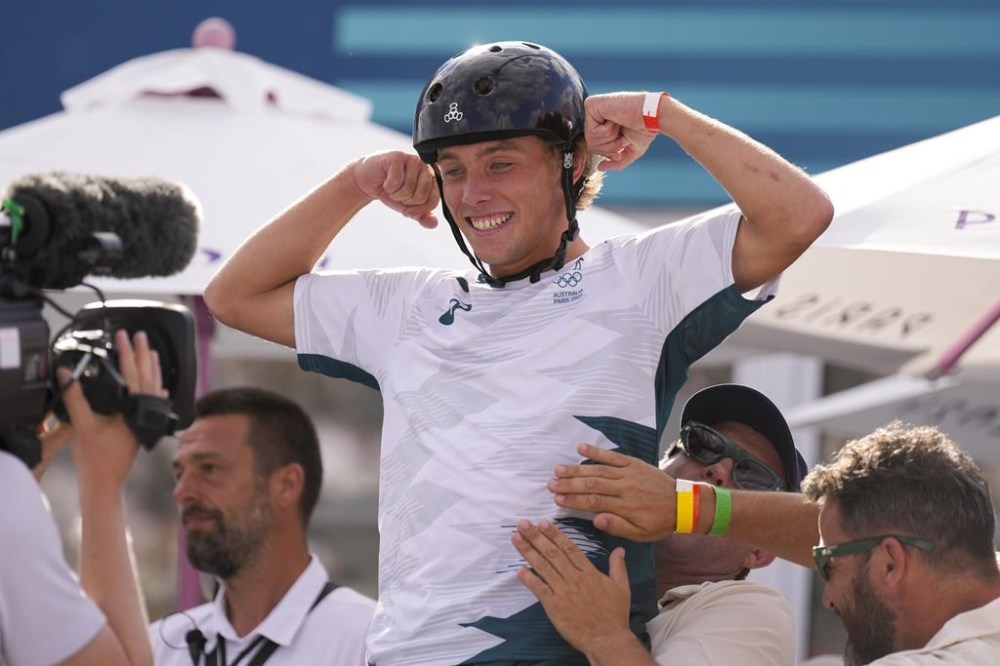 Australia's Keegan Palmer celebrates after winning the gold medal in the men's skateboarding park finals at the 2024 Summer Olympics, Wednesday, Aug. 7, 2024, in Paris, France. (AP Photo/Abbie Parr)