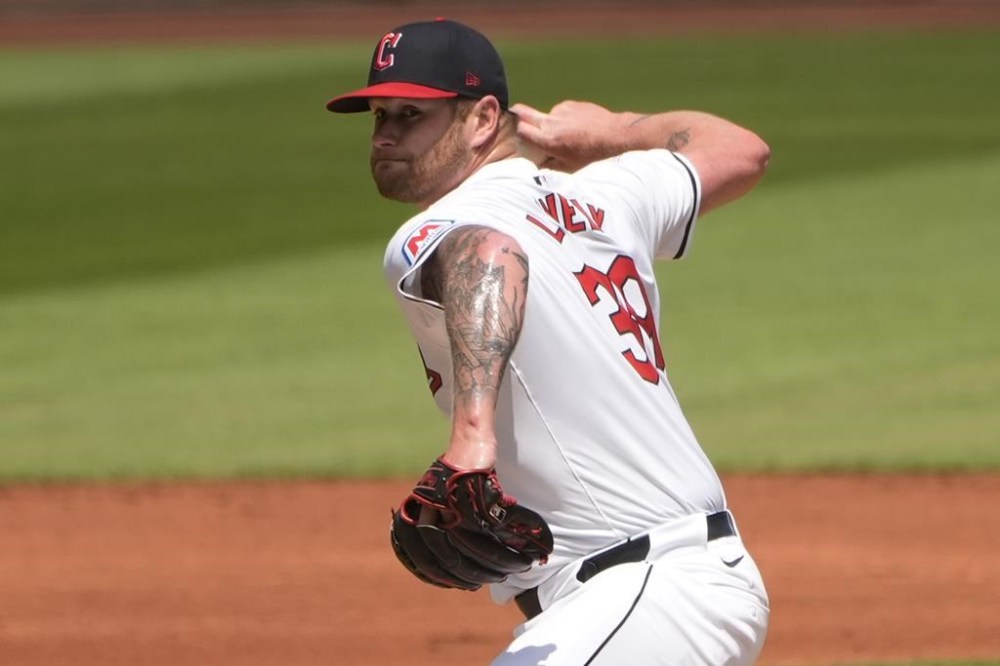 Cleveland Guardians' Ben Lively pitches in the first inning of the first game of a baseball doubleheader against the Arizona Diamondbacks in Cleveland, Wednesday, Aug. 7, 2024. (AP Photo/Sue Ogrocki)