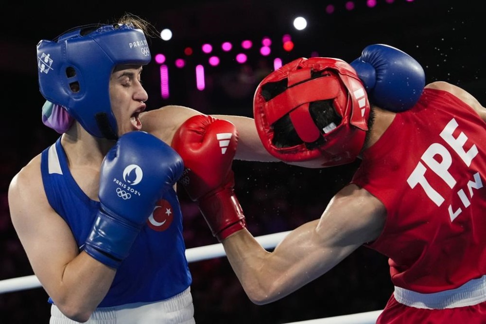 Taiwan's Lin Yu-ting, right, fights Turkey's Esra Yildiz in their women's 57 kg semifinal boxing match at the 2024 Summer Olympics, Wednesday, Aug. 7, 2024, in Paris, France. (AP Photo/Ariana Cubillos)