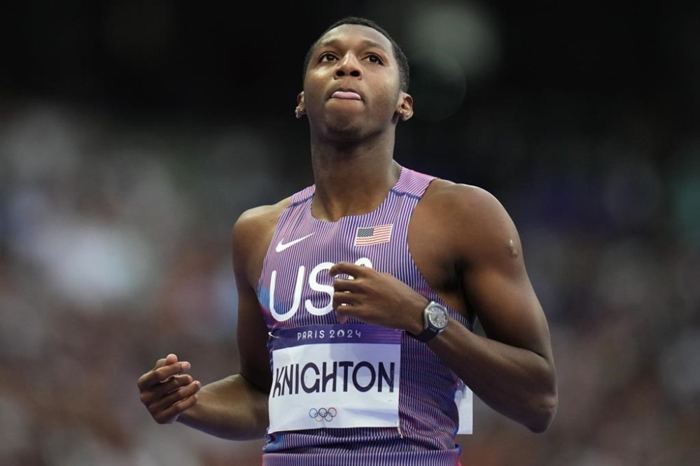 Erriyon Knighton, of the United States, reacts following his men's 200-meter semifinal at the 2024 Summer Olympics, Wednesday, Aug. 7, 2024, in Saint-Denis, France. (AP Photo/Petr David Josek)