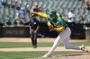 Oakland Athletics pitcher Mason Miller throws to a Chicago White Sox batter during the ninth inning of a baseball game, Wednesday, Aug. 7, 2024, in Oakland, Calif. (AP Photo/Godofredo A. Vásquez)