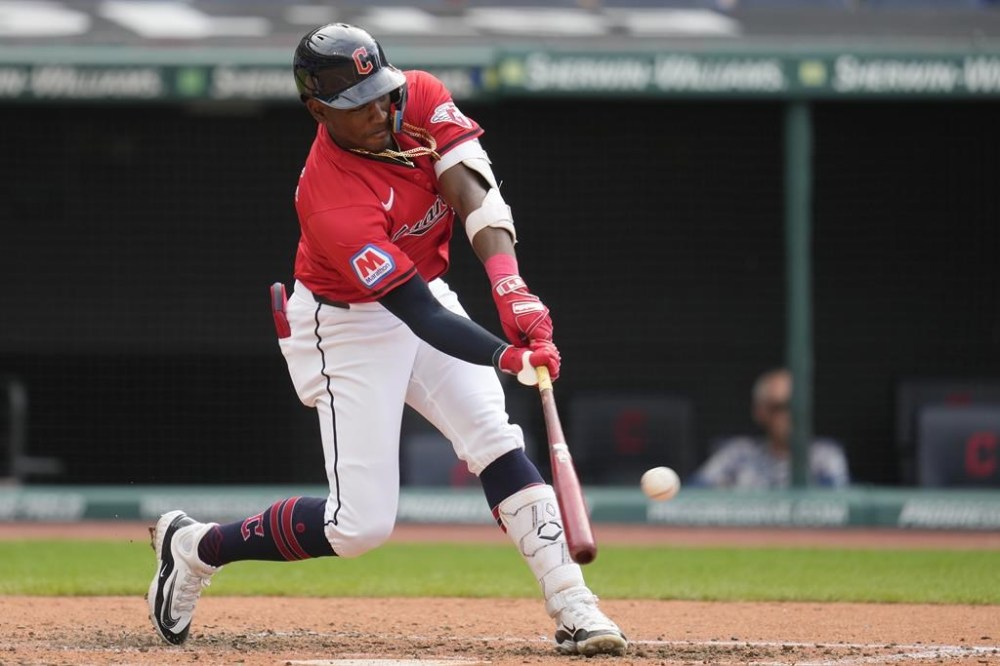 Cleveland Guardians' Angel Martinez hits a sacrifice fly to score Josh Naylor in the fourth inning of the second game of a baseball doubleheader against the Arizona Diamondbacks in Cleveland, Wednesday, Aug. 7, 2024. (AP Photo/Sue Ogrocki)