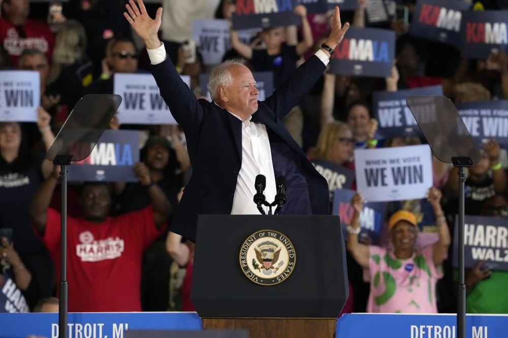 Democratic vice presidential candidate Minnesota Gov. Tim Walz speaks at a campaign rally Wednesday, Aug. 7, 2024, in Romulus, Mich., with Democratic presidential nominee Vice President Kamala Harris. (AP Photo/Carlos Osorio)