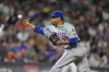 New York Mets pitcher Edwin Díaz works against the Colorado Rockies in the ninth inning of a baseball game Wednesday, Aug. 7, 2024, in Denver. (AP Photo/David Zalubowski)