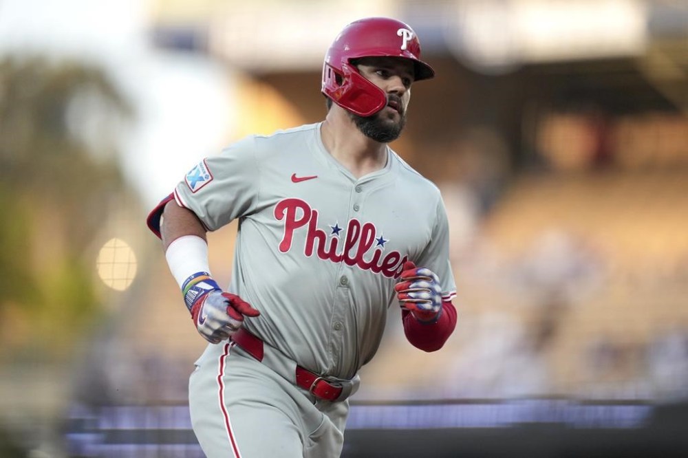 Philadelphia Phillies designated hitter Kyle Schwarber runs the bases after hitting a home run during the first inning of a baseball game against Los Angeles Dodgers in Los Angeles, Wednesday, Aug. 7, 2024. (AP Photo/Eric Thayer)