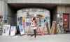 JESSICA LEE / WINNIPEG FREE PRESS

A pedestrian reads posters for the Fringe Festival July 19, 2023 in the Exchange District.