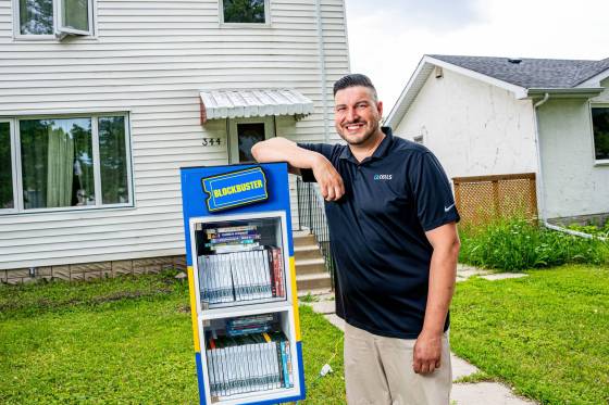 'It's just nice to give back sometimes,' said AJ Ongenae. The Winnipegger said he hopes people will return movies to his free library-style Blockbuster box, or donate their own.  (Nic Adam / Free Press)