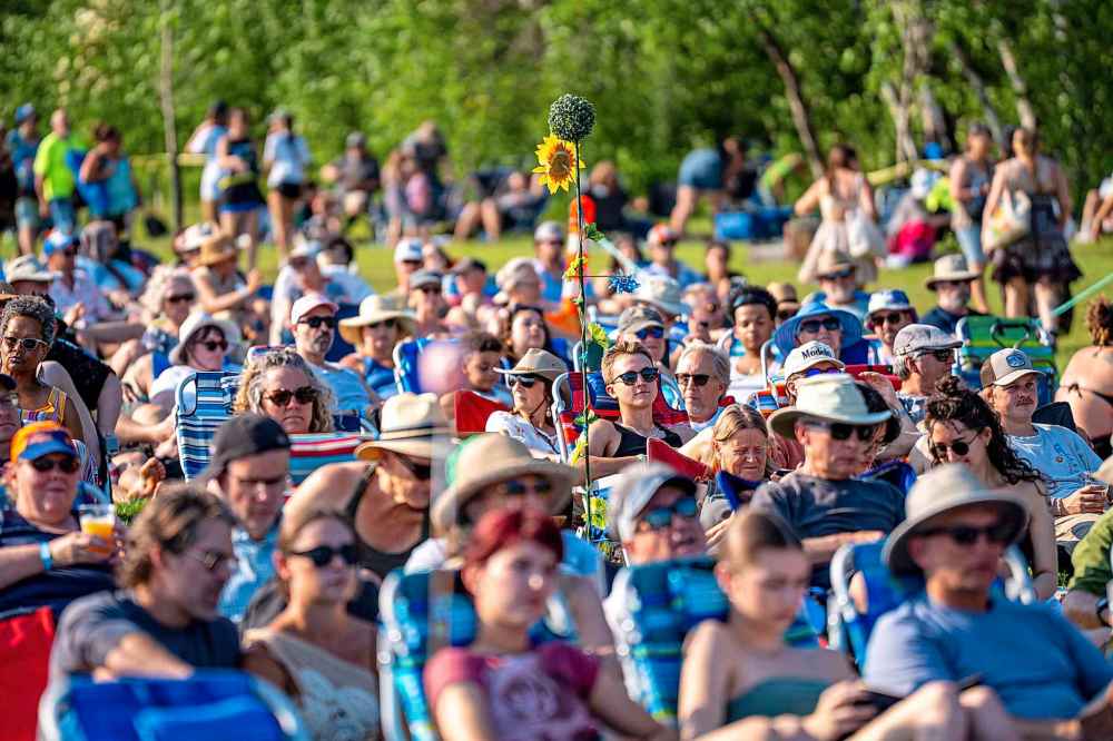NIC ADAM / FREE PRESS
The mainstage crowd bakes in the summer heat Thursday evening.