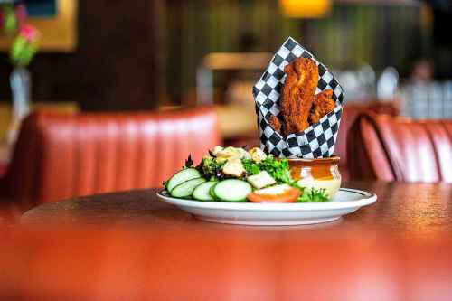 MIKAELA MACKENZIE / FREE PRESS
Chicken fingers and a side salad at Rudy's Eat & Drink on Tuesday, July 23, 2024. 

For Dave Sanderson story.