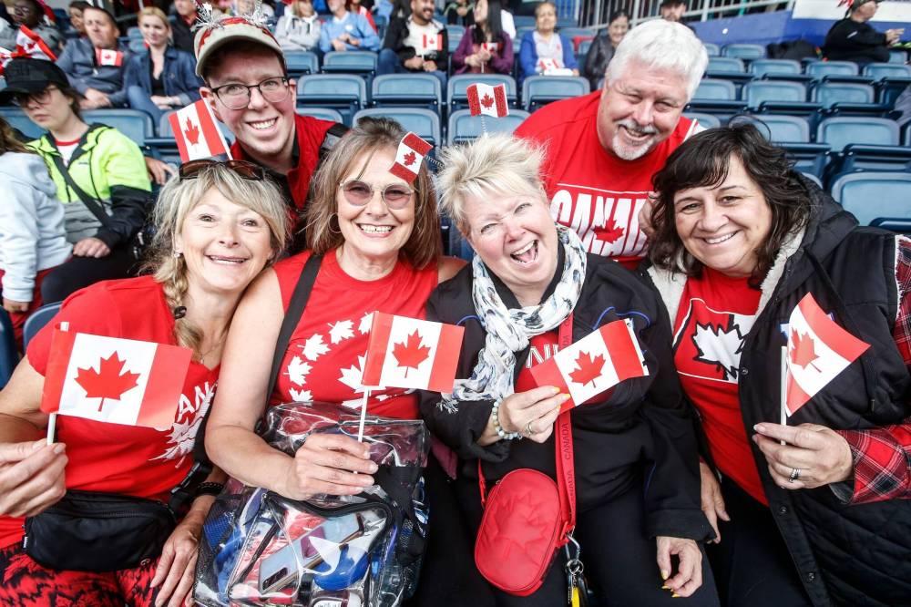 JOHN WOODS / FREE PRESS
Lynne Anderson, from left, Colleen Freund, Shelley Moore and Nicki Clearwater with Brendan Moore and John Clearwater take in the Canada Day celebrations at Princess Auto stadium Monday.