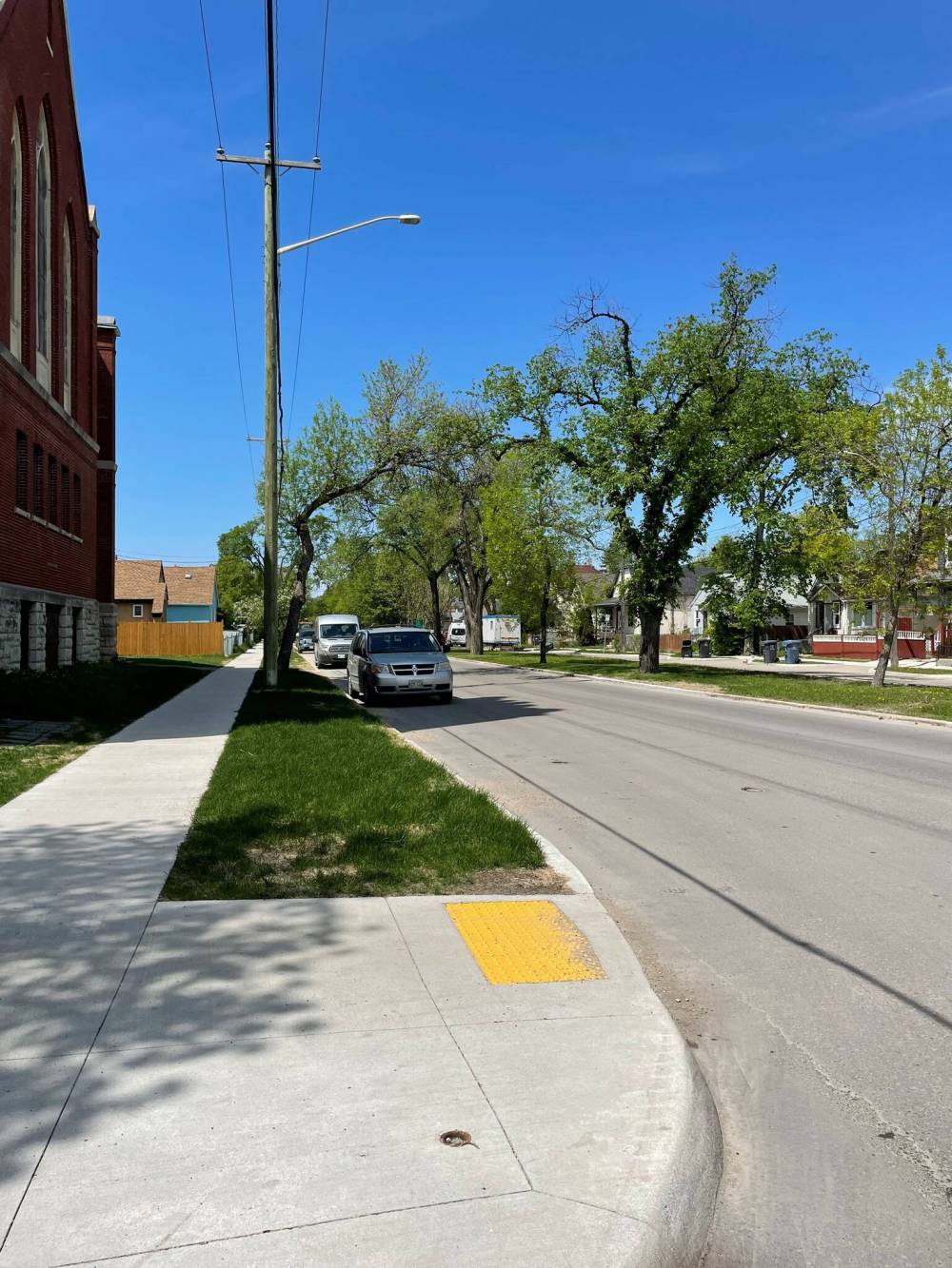 RUTH BONNEVILLE / FREE PRESS FILES
                                City staff were prepared to remove 33 parking spaces from Burrows Avenue to ban parking within 15 metres of intersections between Main and McPhillips streets. The change was intended to reduce the risk of accidents by preventing vehicles from blocking drivers’ sight lines.