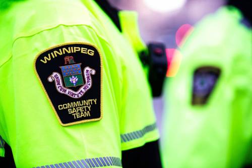 MIKAELA MACKENZIE / FREE PRESS FILES
                                Transit safety officers walk down Graham Avenue on their first day on the job on Tuesday, Feb. 20, 2024. For Chris story.