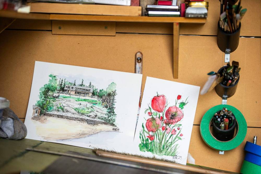 MIKAELA MACKENZIE / FREE PRESS
Toews' ink and wash paintings of Winnipeg are tiny masterpieces, crammed full of detail in an 8-by-8-inch space.