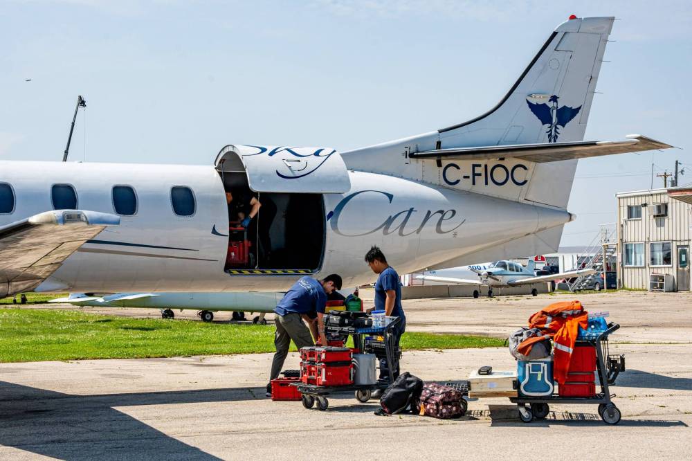 NIC ADAM / FREE PRESS
A SkyCare Air Ambulance restocks after landing at St. Andrews Airport.